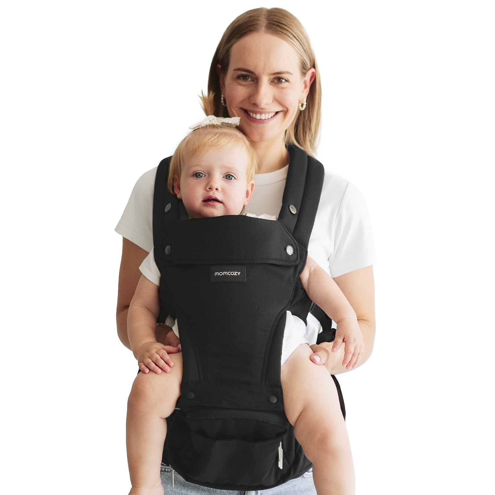 Momcozy Move2Fit Hip Seat Carrier, black, in use. Mother with baby comfortably wearing the carrier.