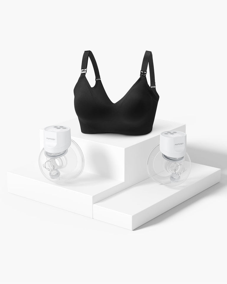 Translation missing: en.Black pumping bra with two white wearable breast pumps on white pedestals