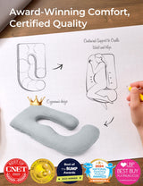 Light grey U-shaped maternity pillow, ergonomic design, supports pregnant women. Award-winning comfort.