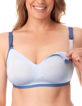 Smiling woman revealing easy access nursing bra, designed for comfort and style.