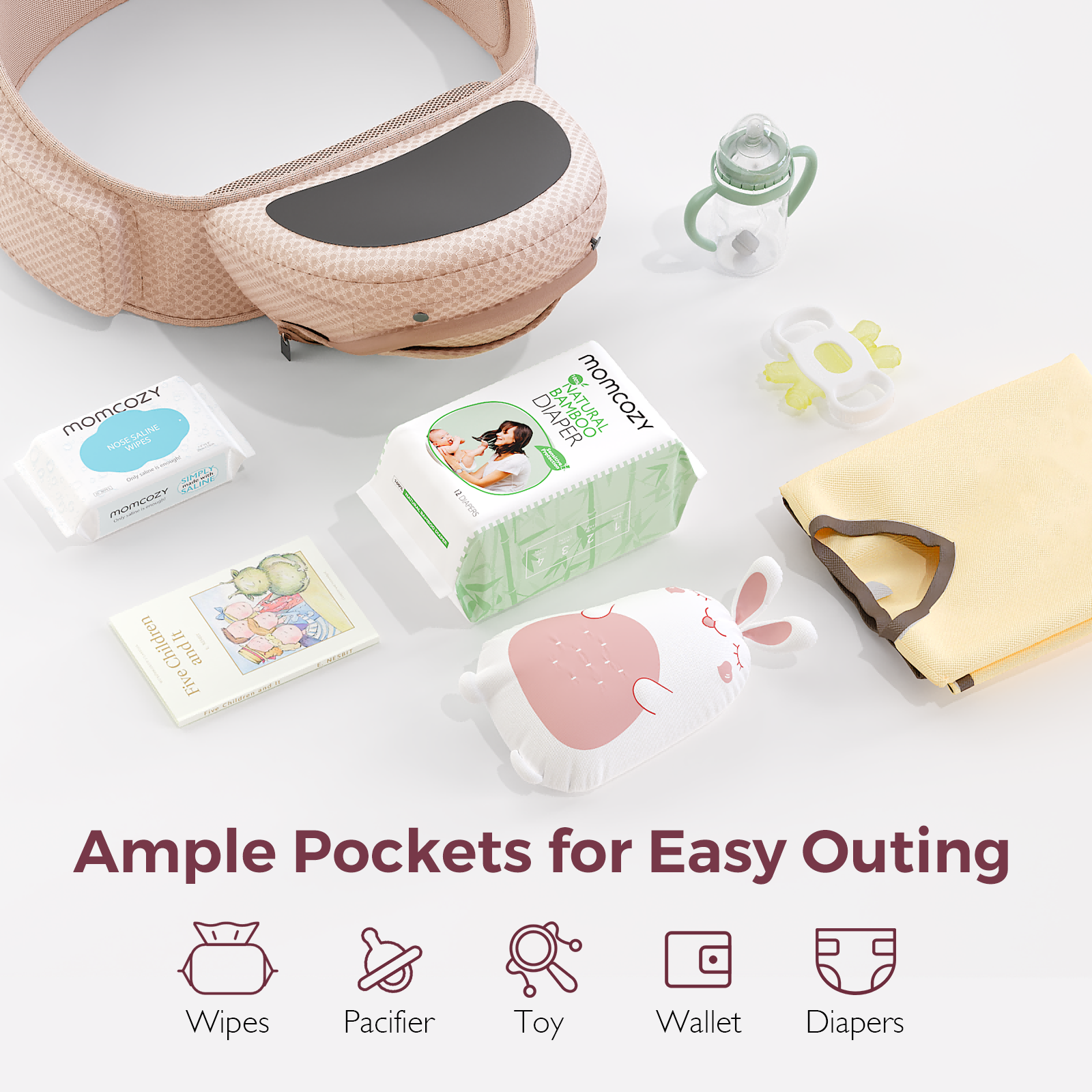 Blush pink Momcozy Hip Seat Carrier, ample pocket storage. Outing essentials: wipes, diaper, and toy. Ergonomic design.