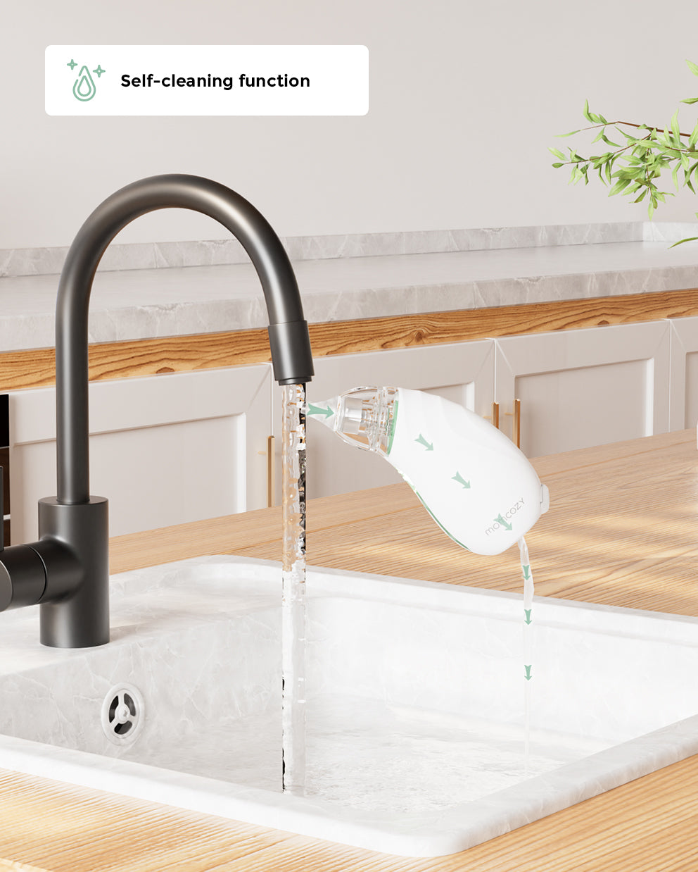 Momcozy baby nasal aspirator self-cleaning function, white aspirator rinsing under faucet for easy cleaning and hygiene.
