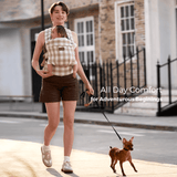 Momcozy PureHug baby carrier in beige gingham, all-day comfort for babywearing while walking a dog