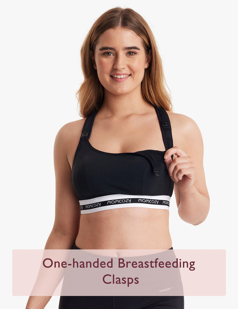 Translation missing: ar.Woman wearing black low impact nursing sports bra with Momcozy logo and one-handed breastfeeding clasps, text 'One-handed Breastfeeding Clasps' displayed at bottom
