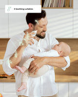 Dad using Momcozy baby nasal aspirator with baby, highlighting 3 soothing lullabies feature for gentle congestion relief