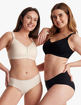 Women showcasing comfortable Oyster Pink and black Mesh Support Padded Wireless Bras with supportive design.