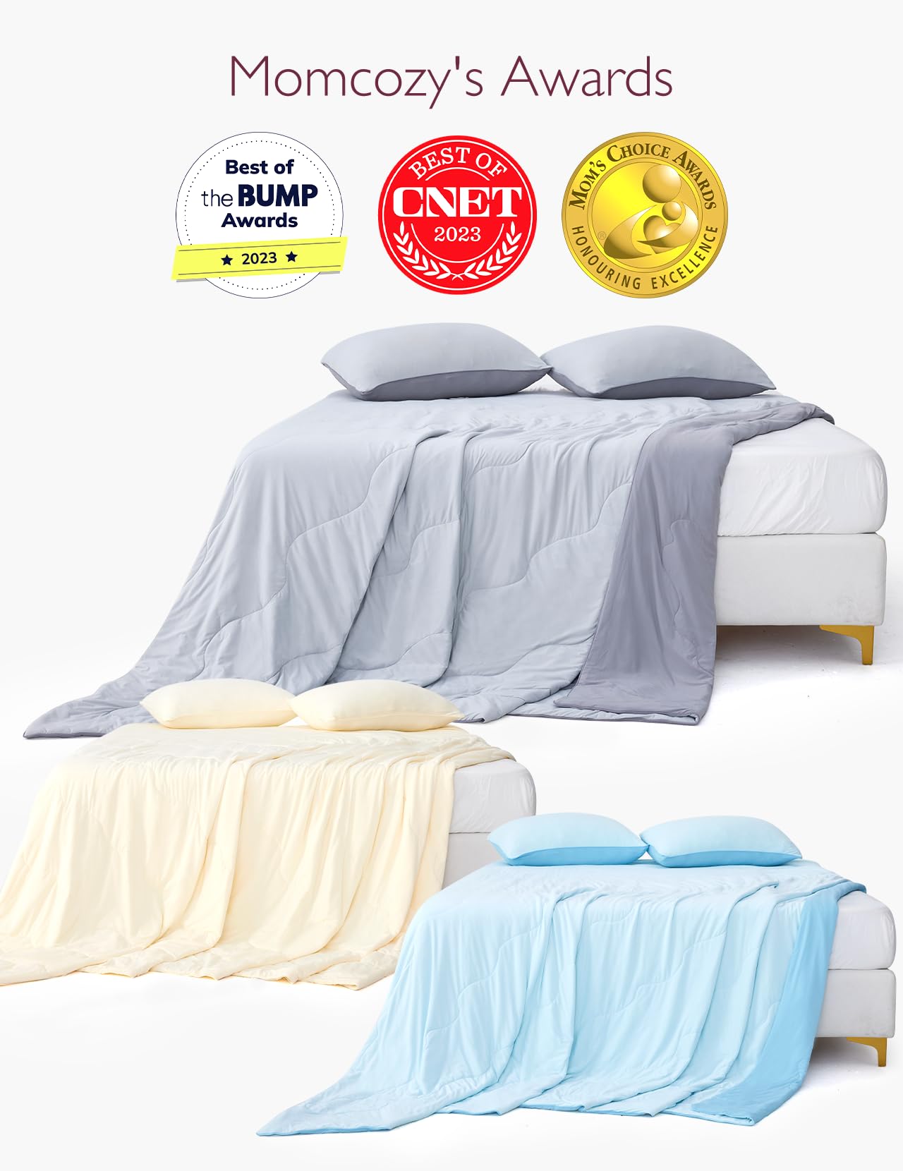Momcozy's award-winning cooling comforters in gray, yellow, and blue on a bed.