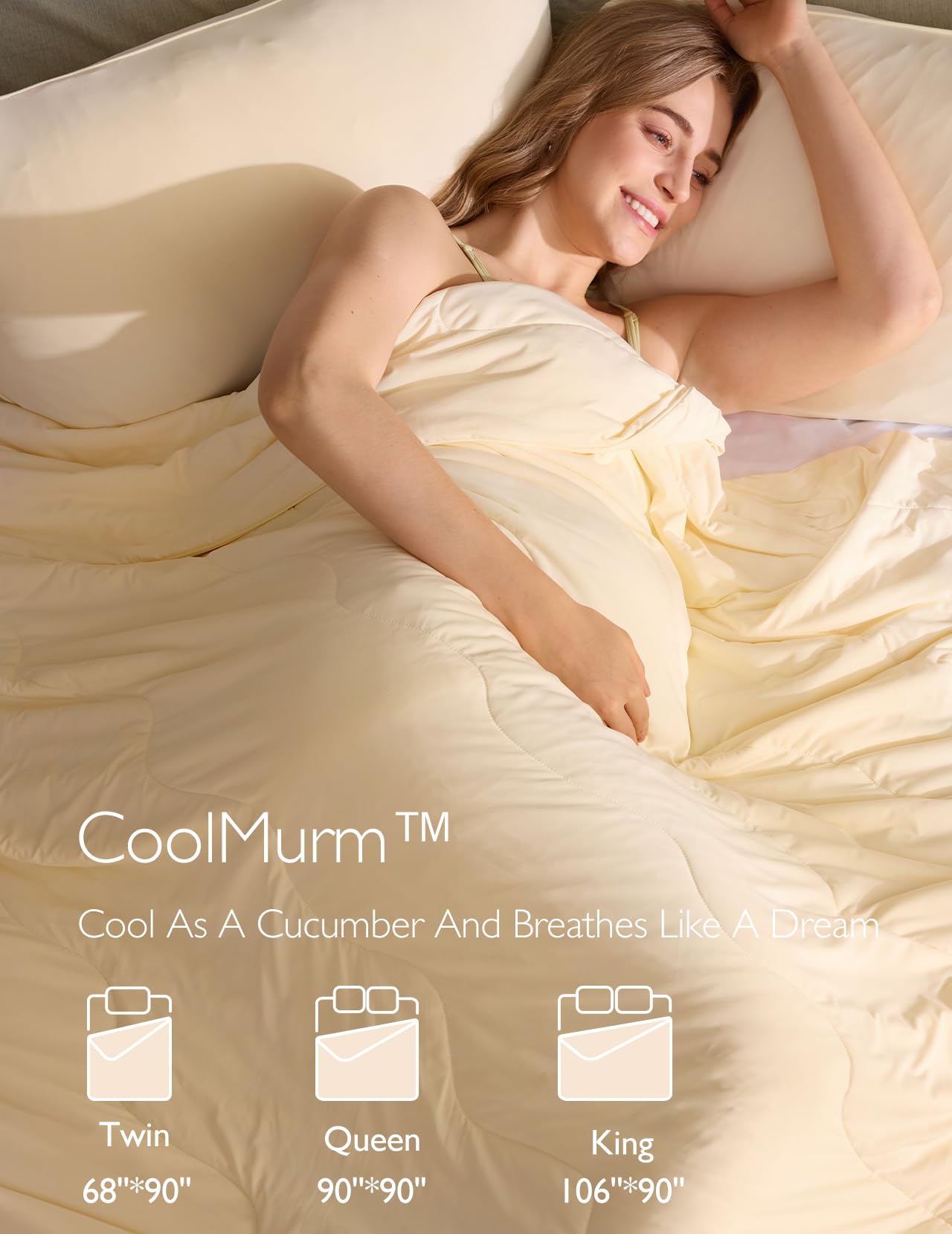 Model enjoying the CoolMurm™ cooling comforter in a serene bedroom setting.