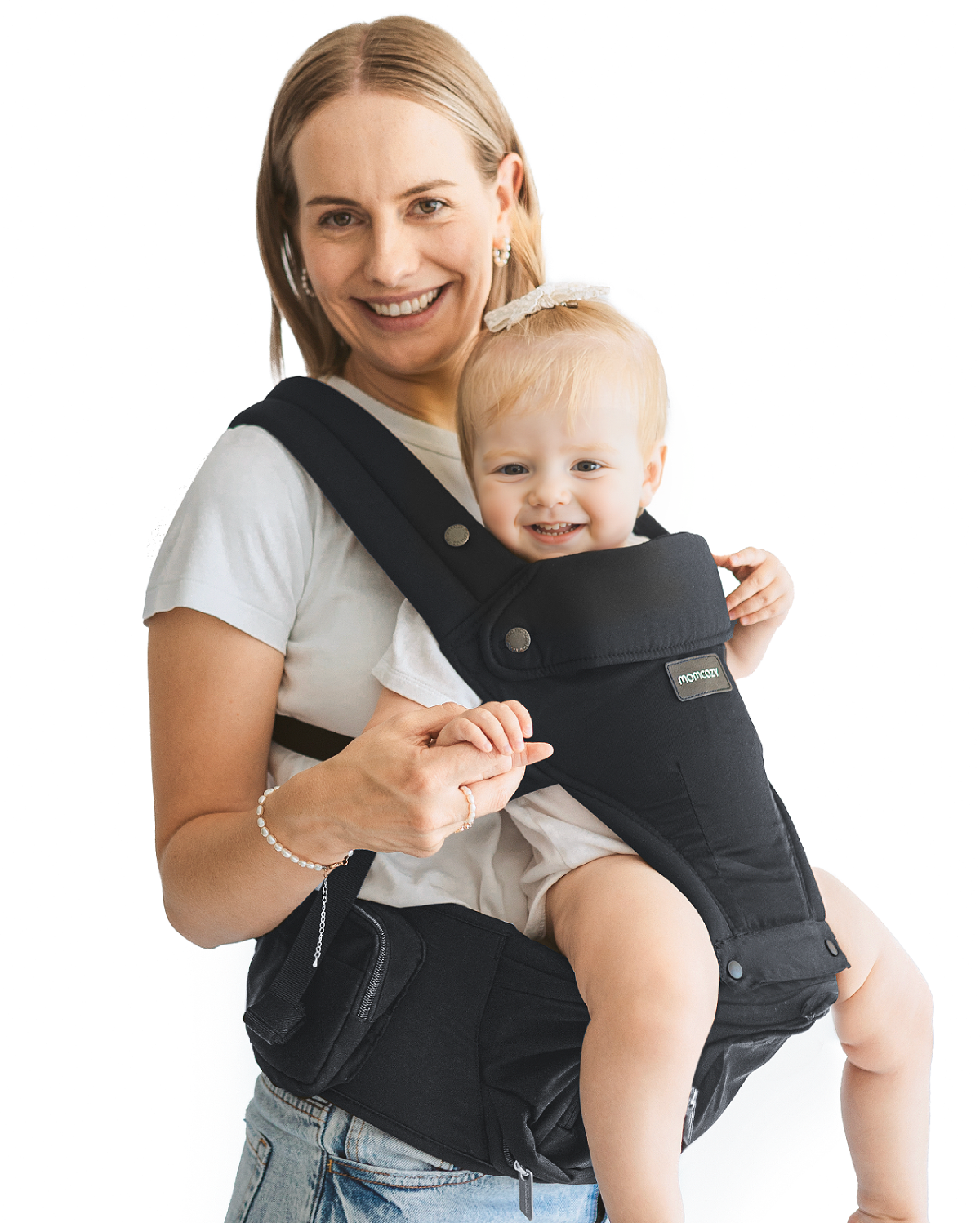 Momcozy Move2Fit Hip Seat Carrier in use. Smiling mother and baby using the comfortable and convenient baby carrier in black.