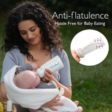 Woman feeding baby with Momcozy anti-flatulence bottle for easy, hassle-free feeding.