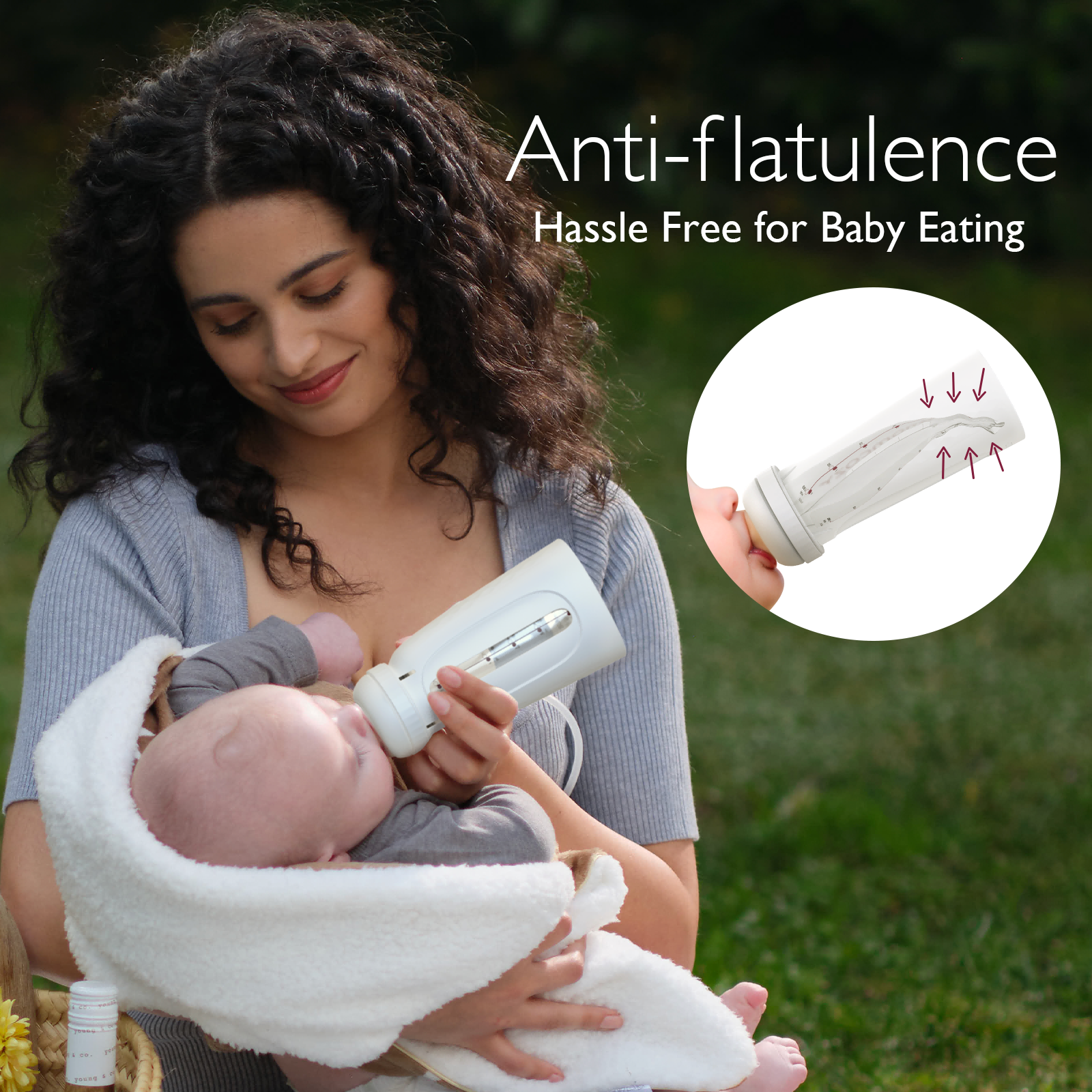Woman feeding baby with Momcozy anti-flatulence bottle for easy, hassle-free feeding.