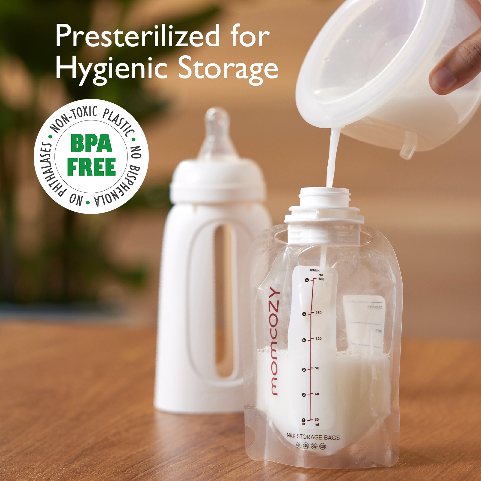 Momcozy breast milk storage bag filling with breast milk, BPA-free and presterilized.