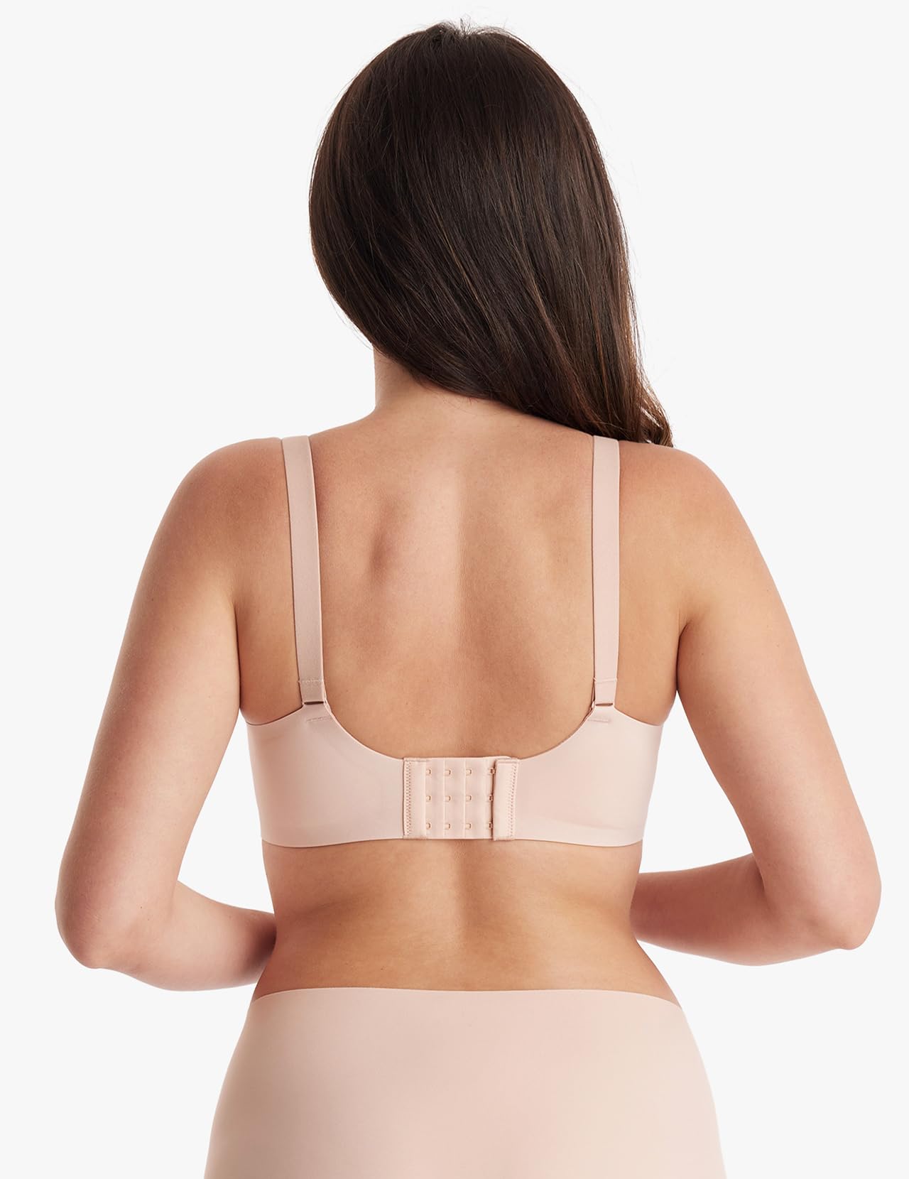 Back view of a woman wearing an Oyster Pink Mesh Support Padded Wireless Bra with adjustable straps.