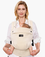 Momcozy PureHug baby carrier in beige, comfortable babywearing for mother and baby, promotes bonding.