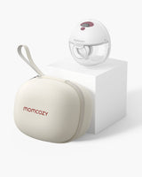 Momcozy M5 Wearable Breast Pump with cream storage case on white display pedestal.